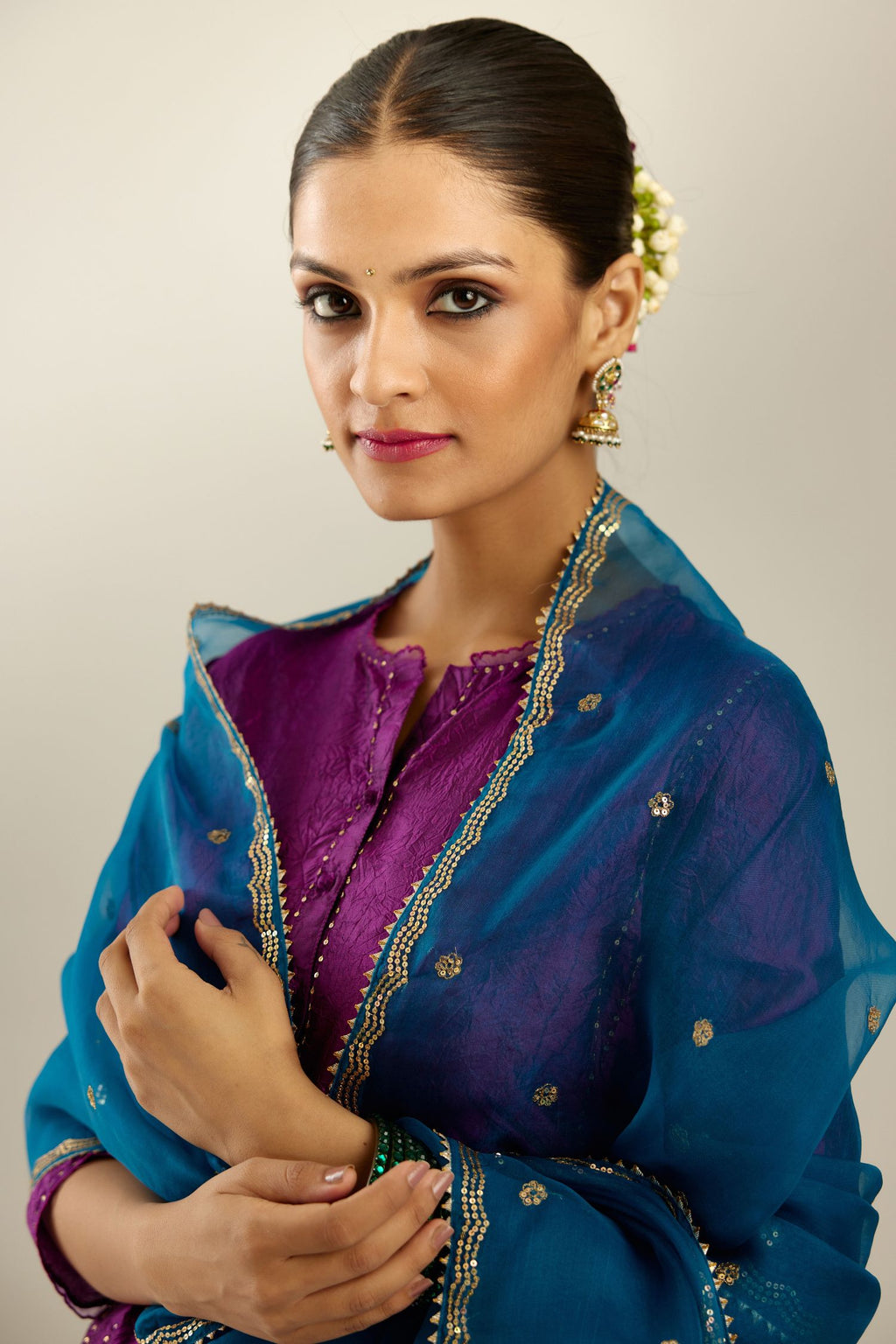 Silk hand crushed short kalidar kurta set with button placket, highlighted with gold sequins and embroidered scalloped organza at edges.