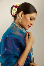 Silk hand crushed short kalidar kurta set with button placket, highlighted with gold sequins and embroidered scalloped organza at edges.