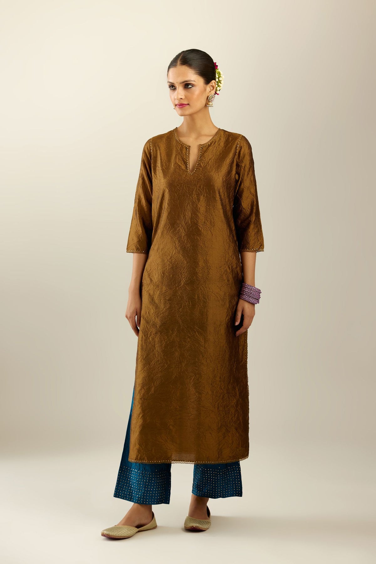 Golden olive silk straight kurta set, highlighted with organza and sequins at edges.
