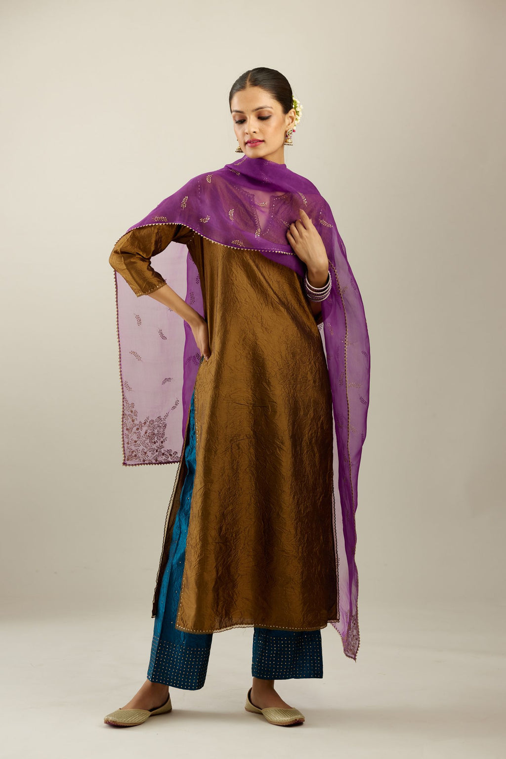 Golden olive silk straight kurta set, highlighted with organza and sequins at edges.