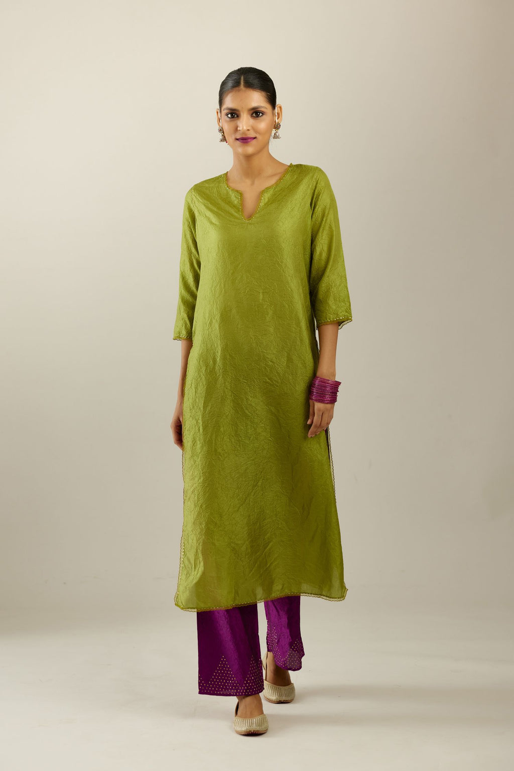 Apple green silk straight kurta set, highlighted with organza and sequins at edges.