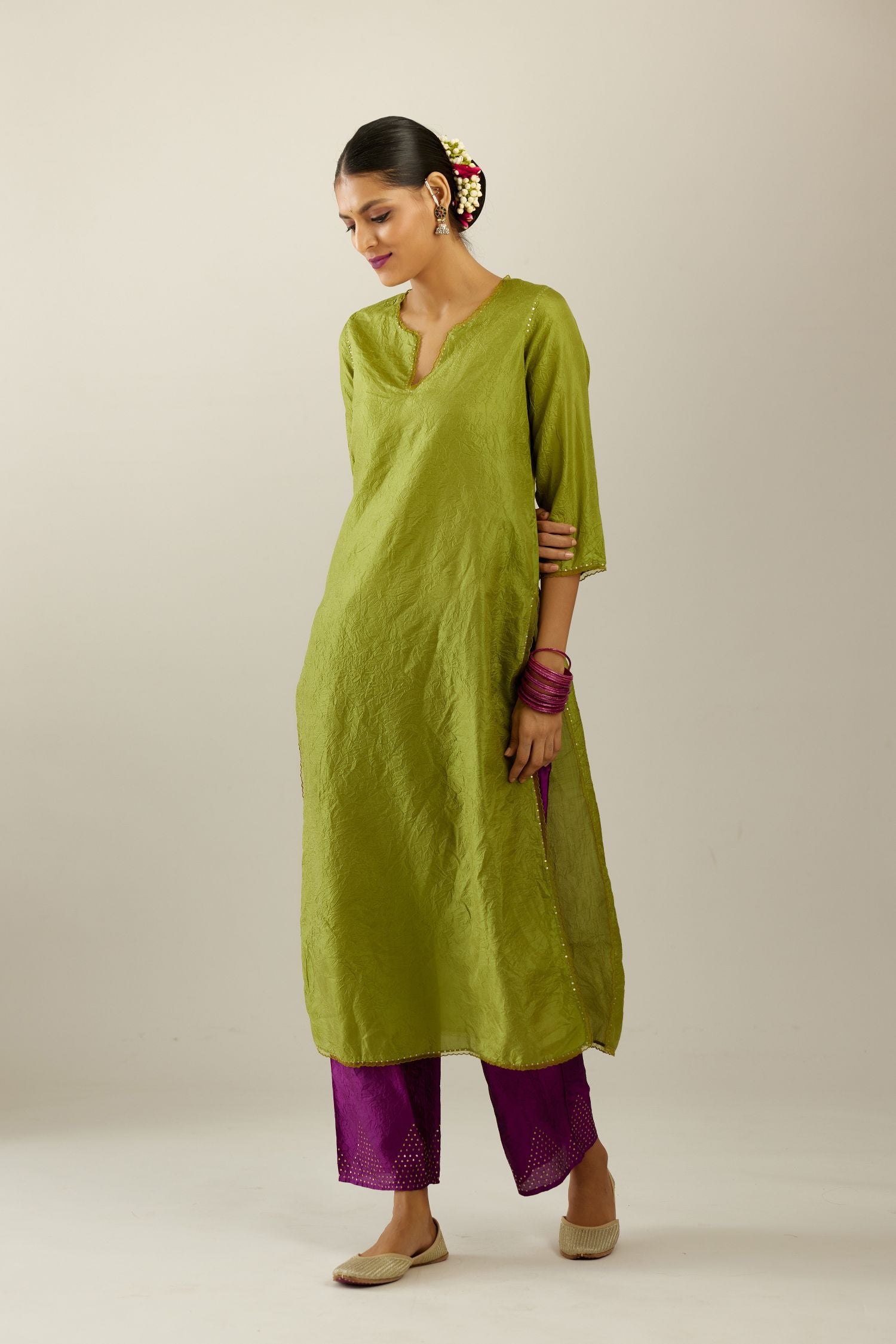 Apple green silk straight kurta set, highlighted with organza and sequins at edges.