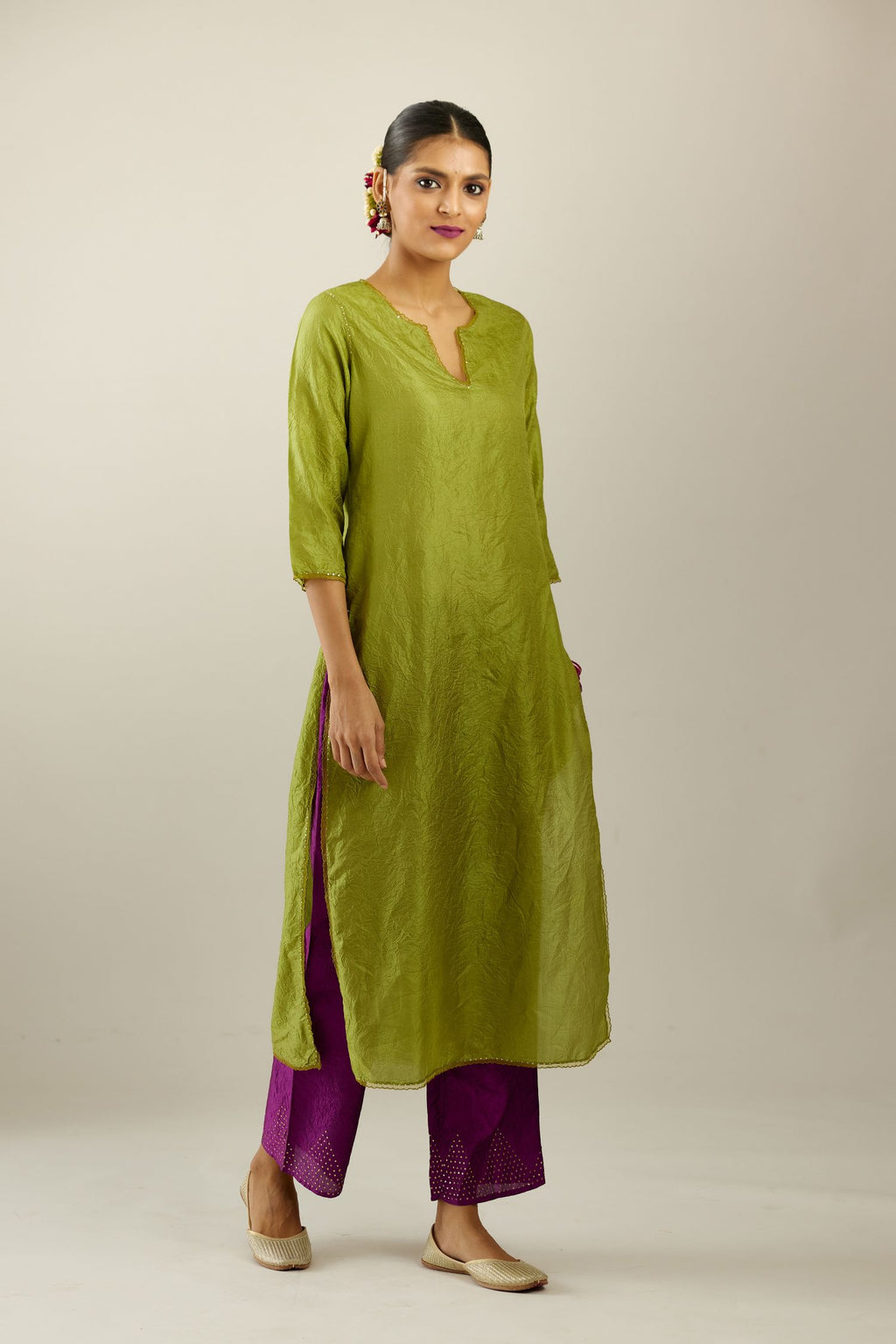 Apple green silk straight kurta set, highlighted with organza and sequins at edges.