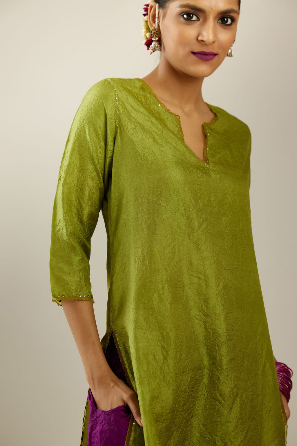 Apple green silk straight kurta set, highlighted with organza and sequins at edges.