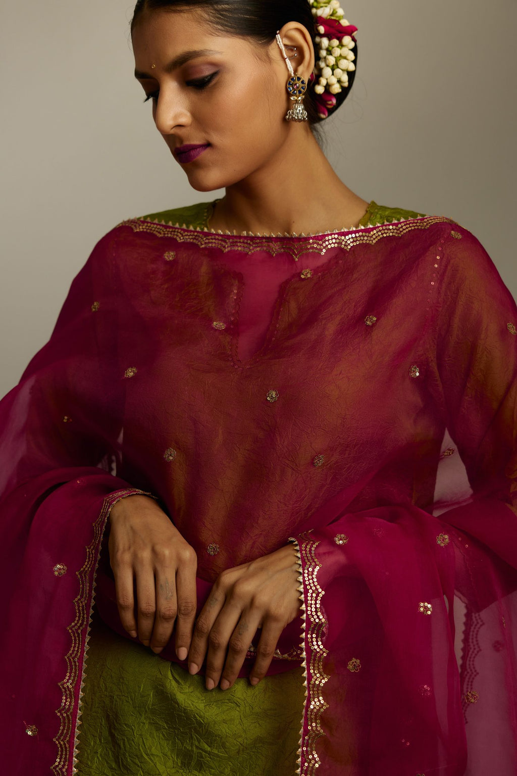 Apple green silk straight kurta set, highlighted with organza and sequins at edges.