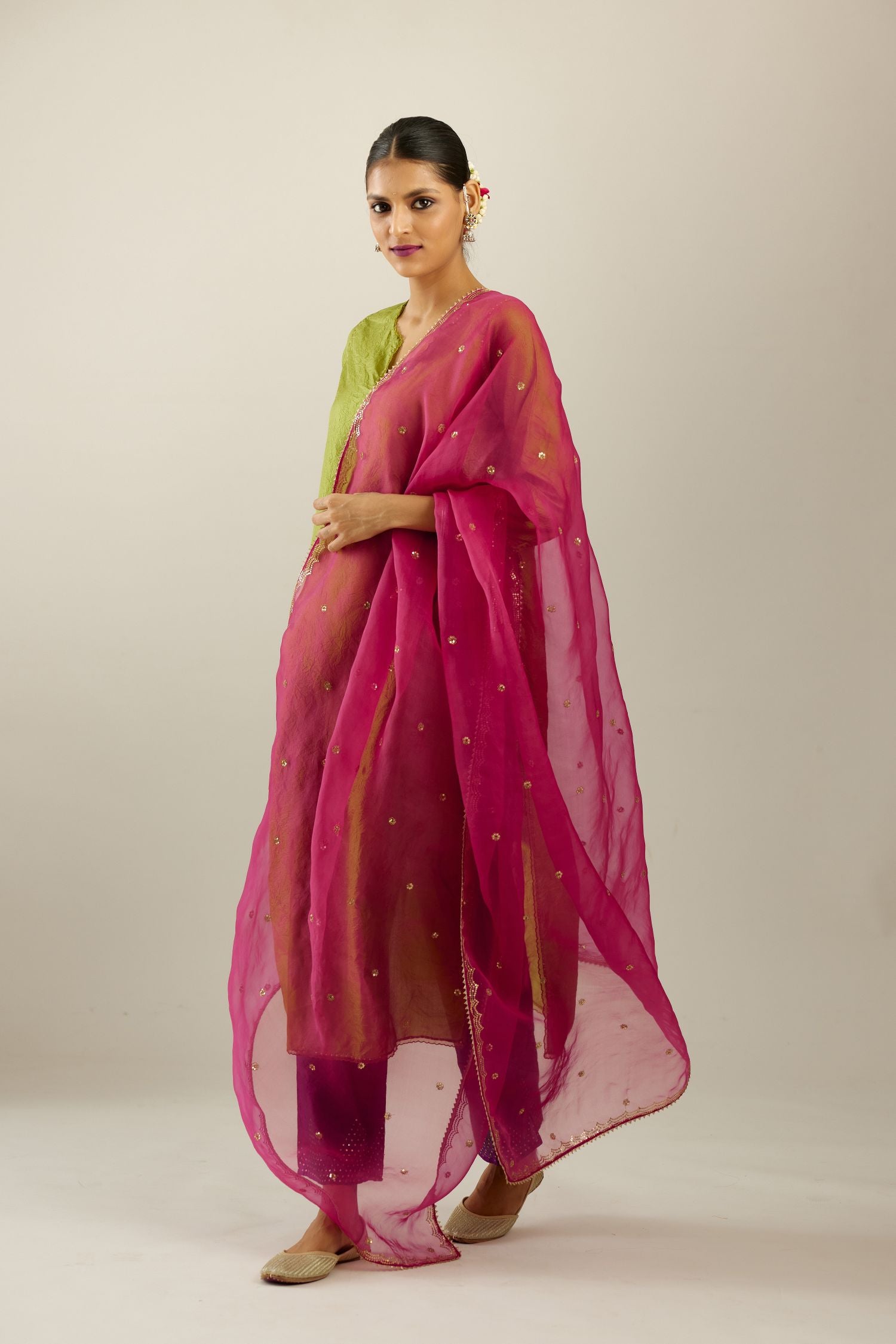 Apple green silk straight kurta set, highlighted with organza and sequins at edges.