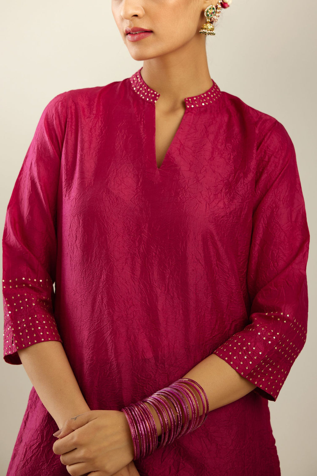 Jazzberry jam silk hand crushed kurta with collar neckline, highlighted with gold sequins.