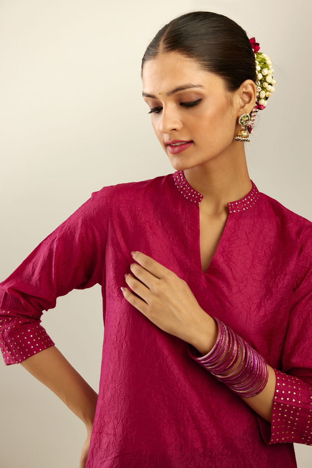 Jazzberry jam silk hand crushed kurta with collar neckline, highlighted with gold sequins.