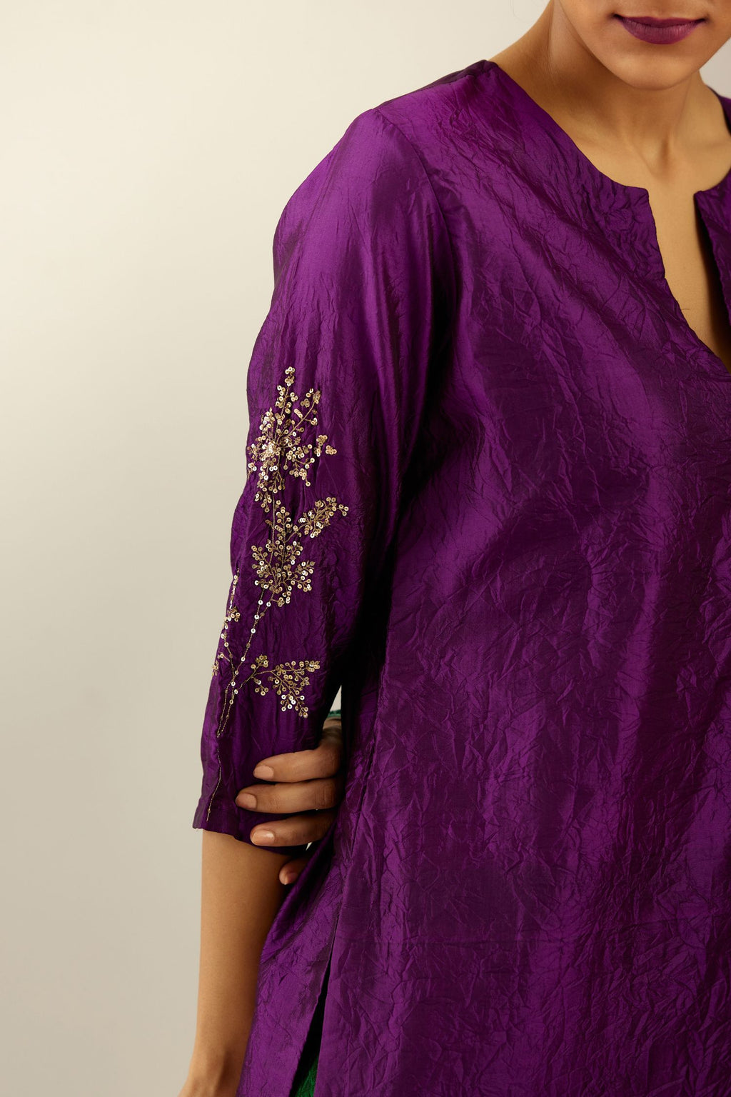 Plum purple hand crushed silk straight kurta set, highlighted with a single zari and sequins boota.