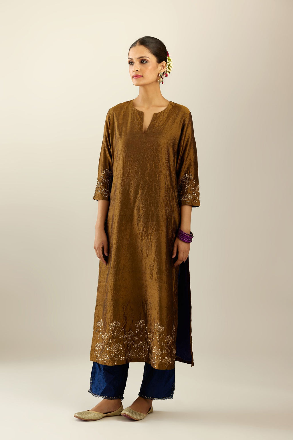 Golden olive hand crushed silk straight kurta set, highlighted with zari and sequins work at sleeve and hem.