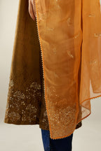 Golden olive hand crushed silk straight kurta set, highlighted with zari and sequins work at sleeve and hem.
