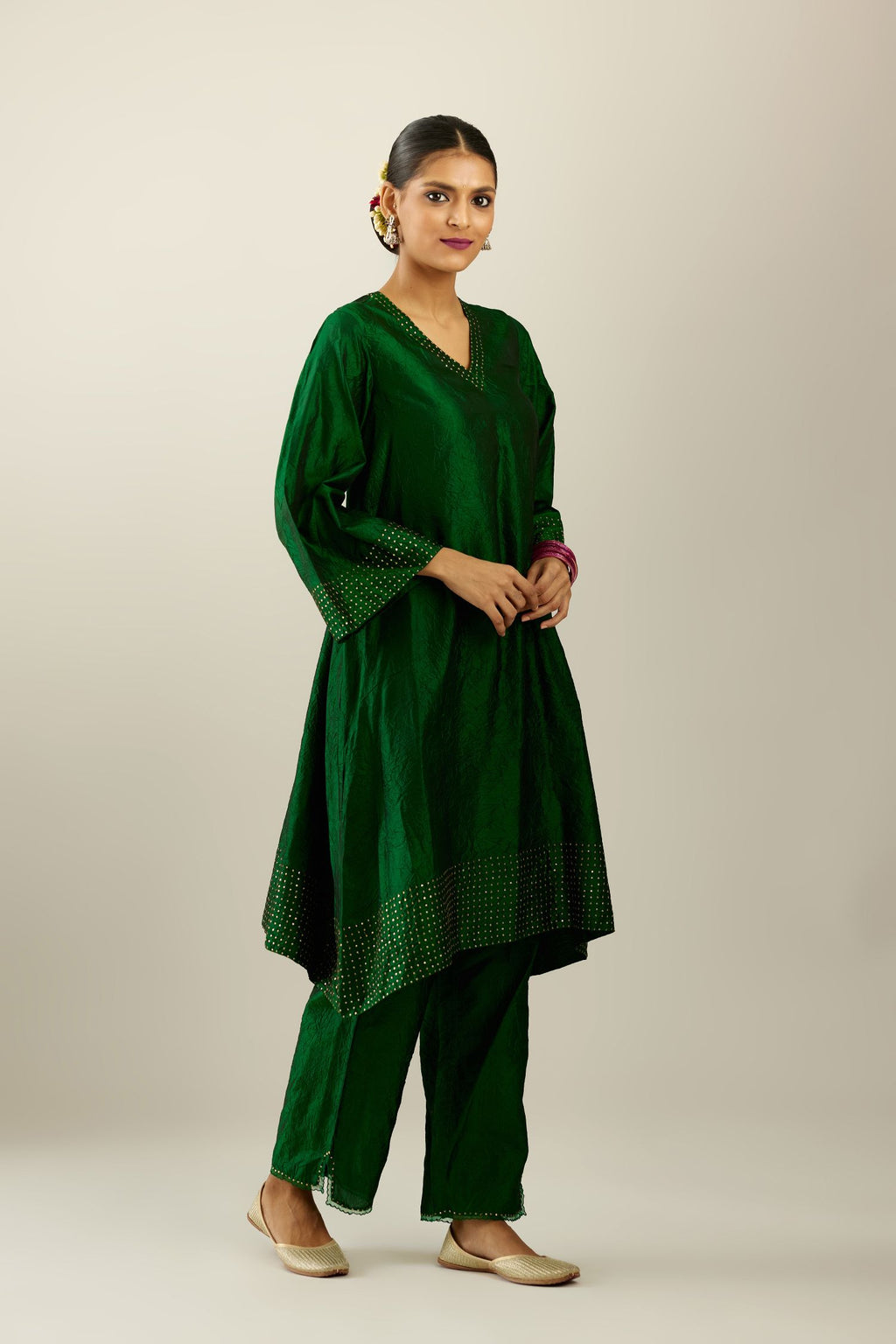 Dark green silk hand crushed easy fit straight hem kurta set, highlighted with a broad gold sequins border at hem.