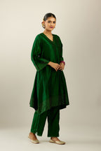 Dark green silk hand crushed easy fit straight hem kurta set, highlighted with a broad gold sequins border at hem.