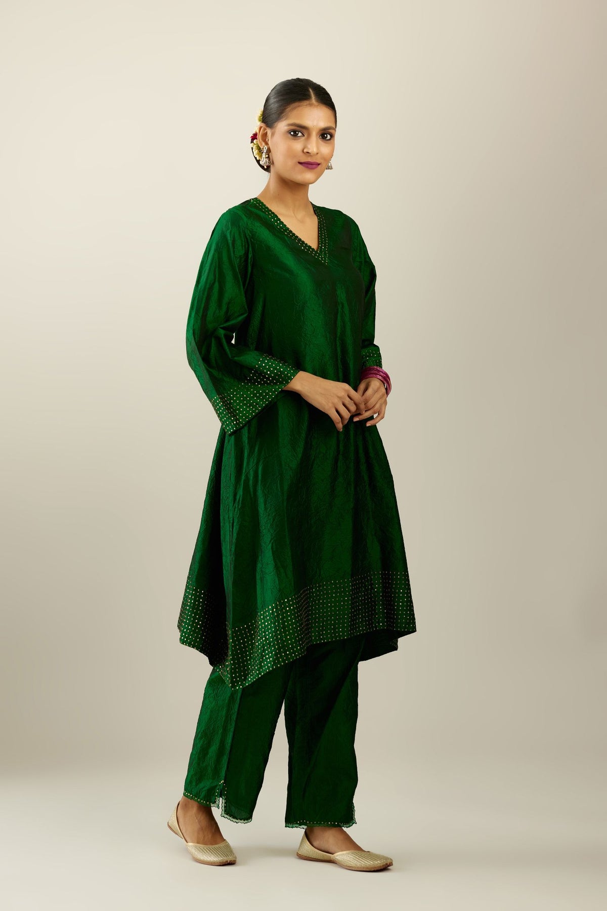 Dark green silk hand crushed easy fit straight hem kurta set, highlighted with a broad gold sequins border at hem.