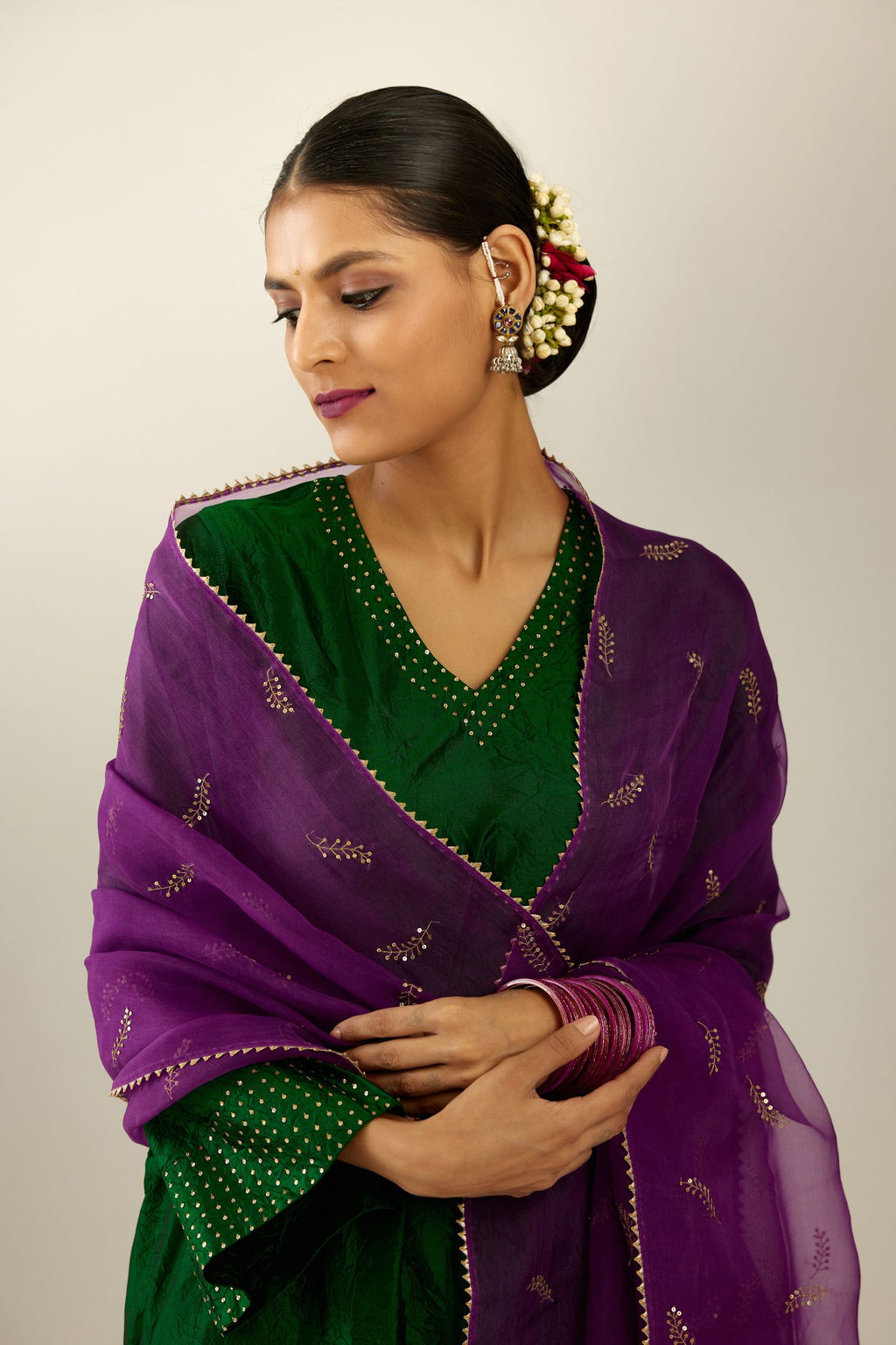 Dark green silk hand crushed easy fit straight hem kurta set, highlighted with a broad gold sequins border at hem.