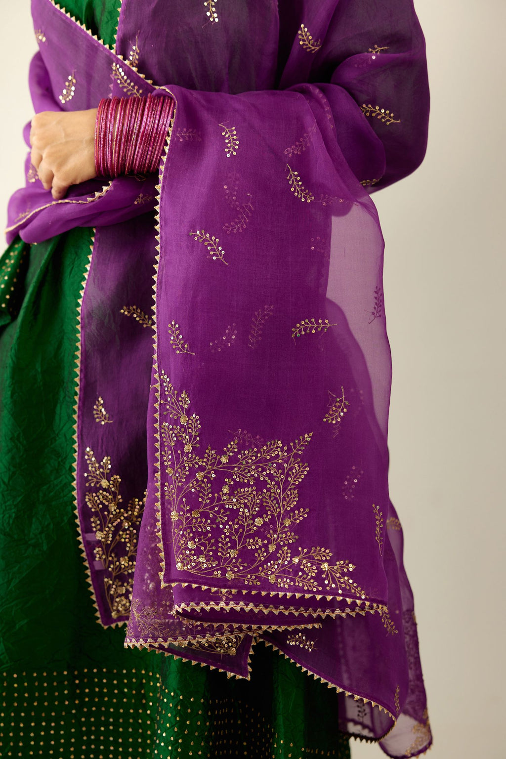 Dark green silk hand crushed easy fit straight hem kurta set, highlighted with a broad gold sequins border at hem.