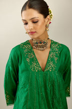 Grass green hand crushed silk kurta dress set with a V neck embroidered yoke and panels.