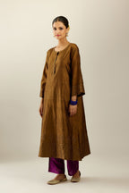 Golden olive silk hand crushed kurta set with concealed button placket neckline, highlighted with gold sequins heavy work at hem.