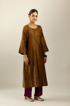 Golden olive silk hand crushed kurta set with concealed button placket neckline, highlighted with gold sequins heavy work at hem.