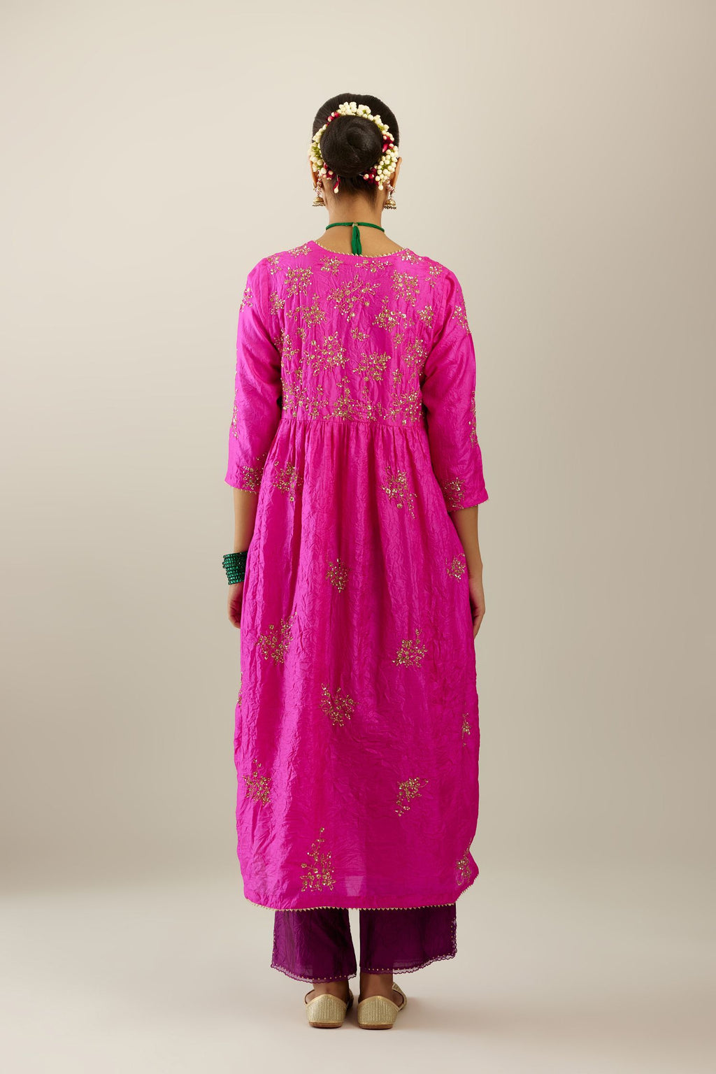 Fiji fuchsia silk hand crushed V neck gathered kurta set, highlighted with all-over gold sequins boota.