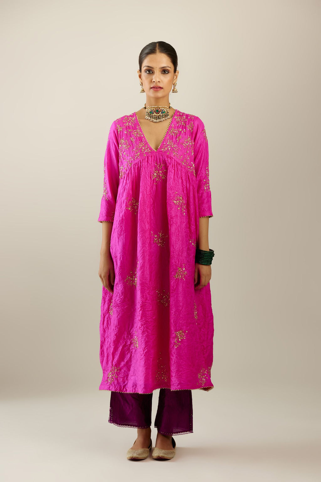 Fiji fuchsia silk hand crushed V neck gathered kurta set, highlighted with all-over gold sequins boota.