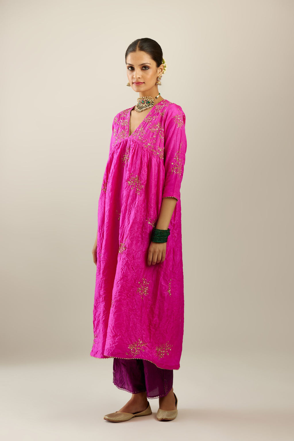 Fiji fuchsia silk hand crushed V neck gathered kurta set, highlighted with all-over gold sequins boota.