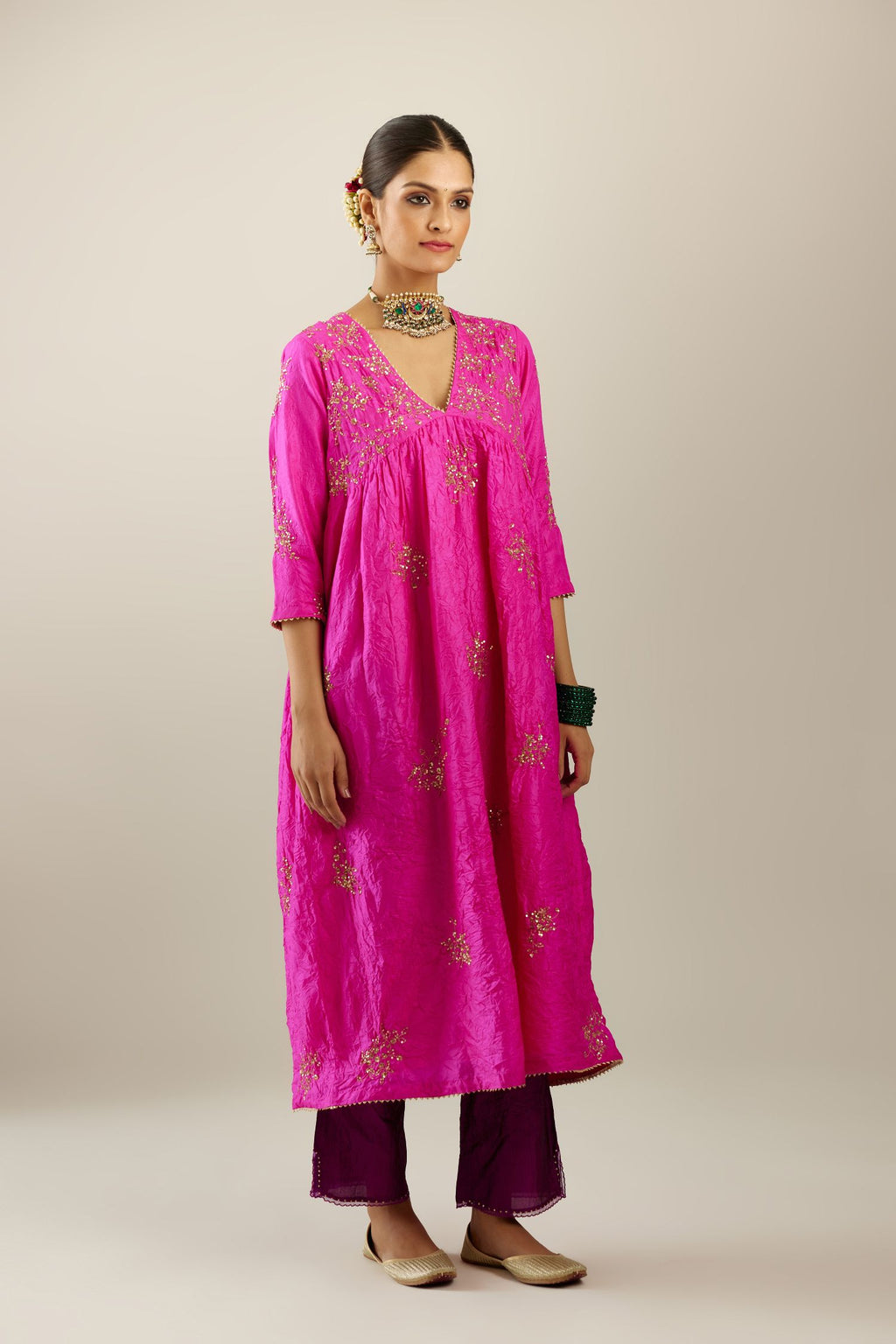 Fiji fuchsia silk hand crushed V neck gathered kurta set, highlighted with all-over gold sequins boota.