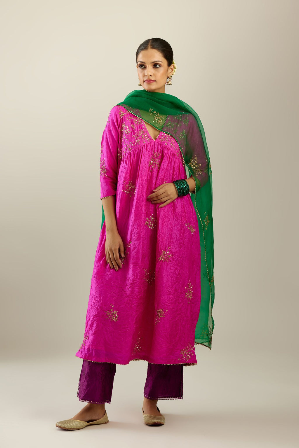 Fiji fuchsia silk hand crushed V neck gathered kurta set, highlighted with all-over gold sequins boota.