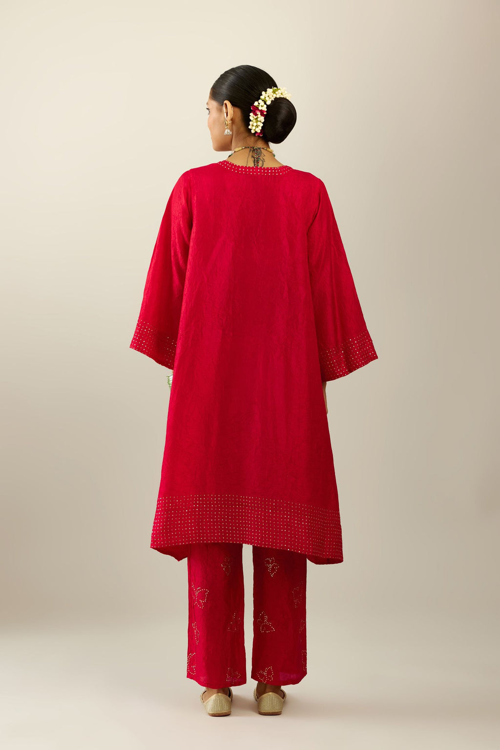 Red silk hand crushed easy fit straight hem kurta set, highlighted with a broad gold sequins border at hem