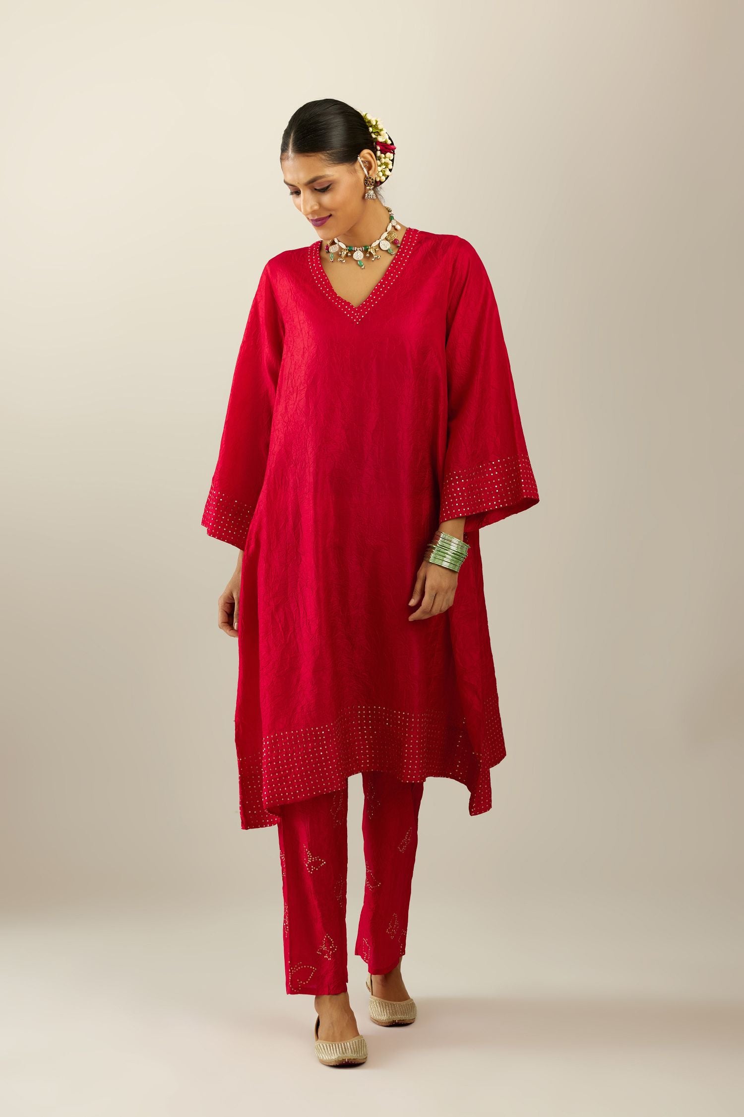 Red silk hand crushed easy fit straight hem kurta set, highlighted with a broad gold sequins border at hem