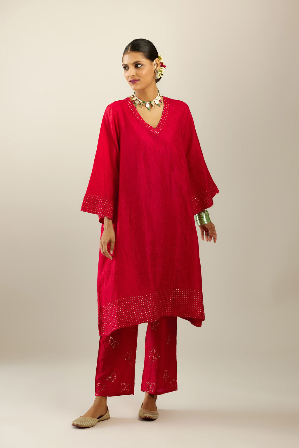 Red silk hand crushed easy fit straight hem kurta set, highlighted with a broad gold sequins border at hem