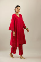 Red silk hand crushed easy fit straight hem kurta set, highlighted with a broad gold sequins border at hem