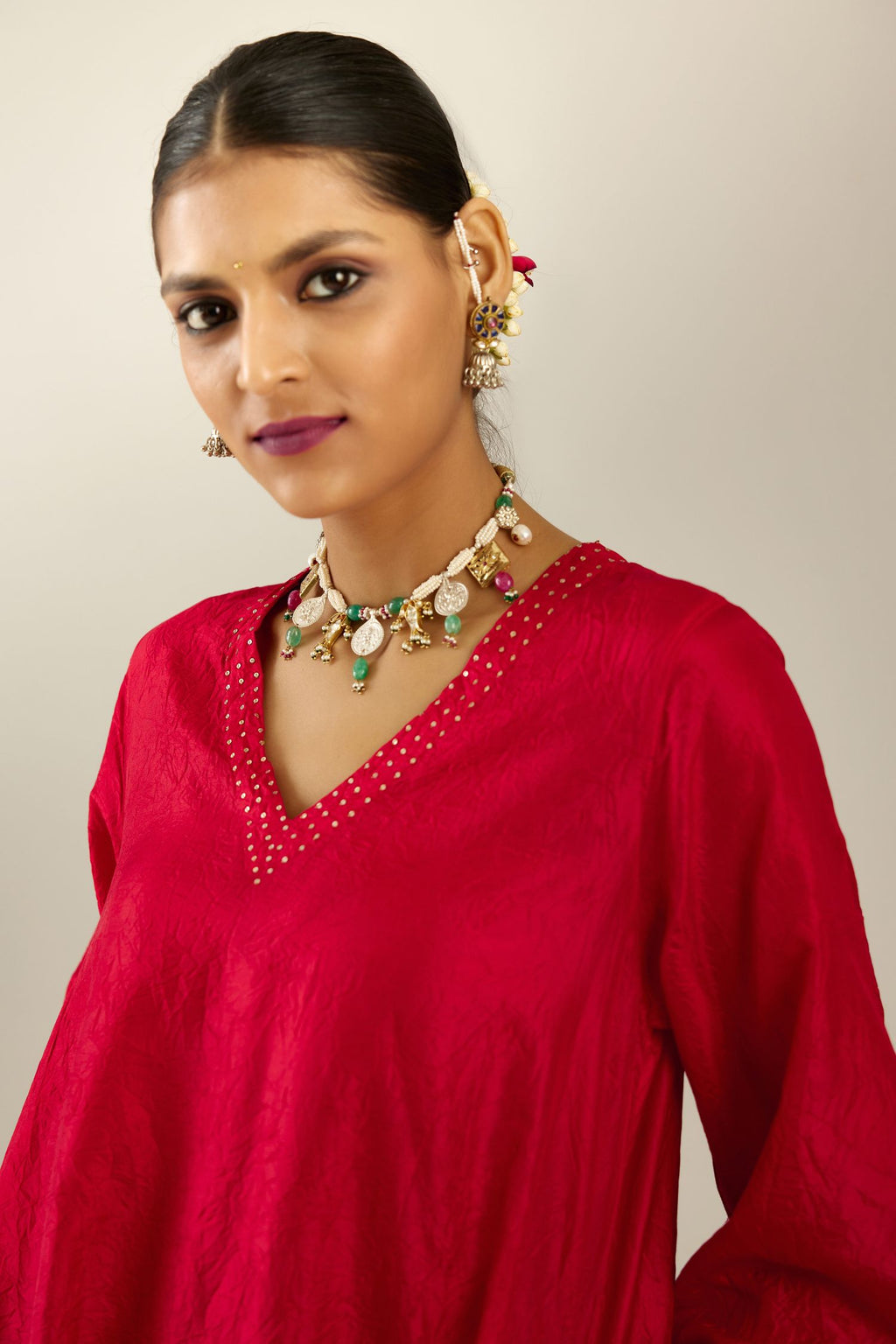 Red silk hand crushed easy fit straight hem kurta set, highlighted with a broad gold sequins border at hem