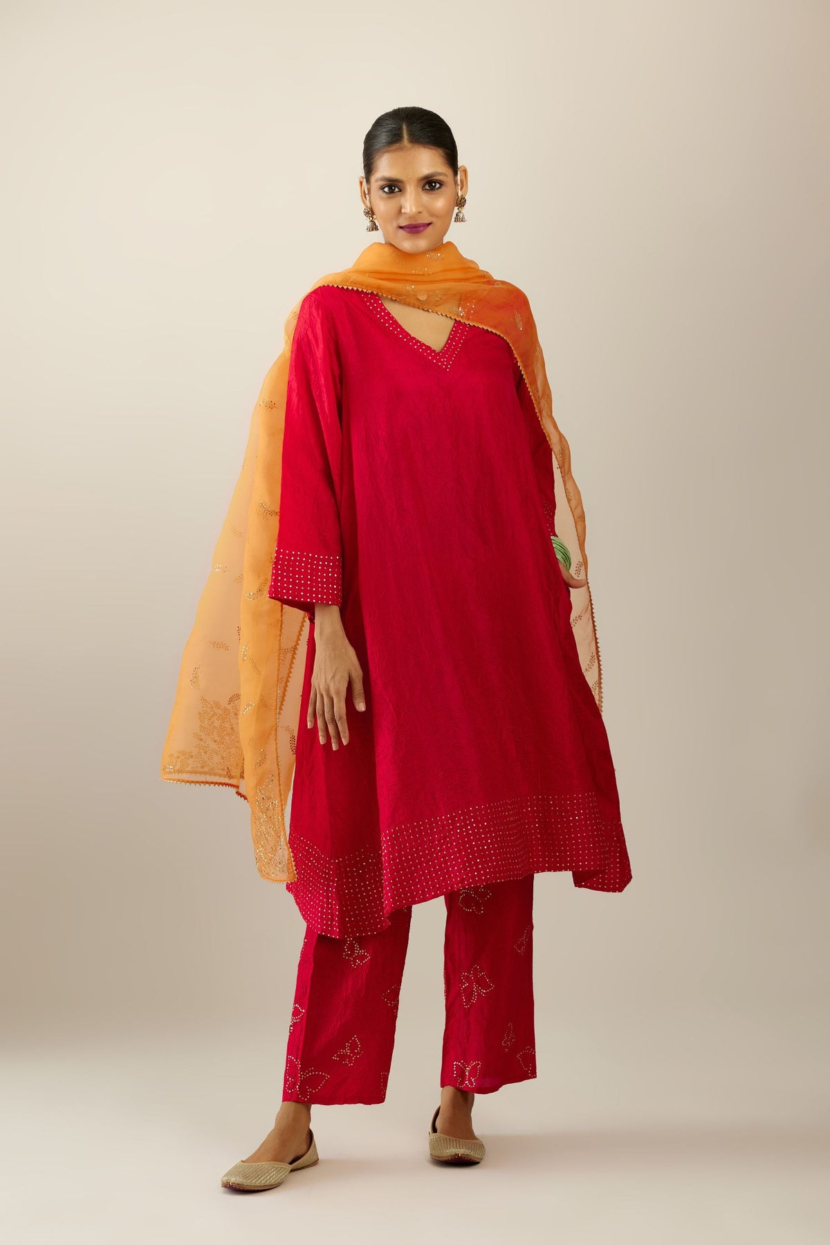 Red silk hand crushed easy fit straight hem kurta set, highlighted with a broad gold sequins border at hem