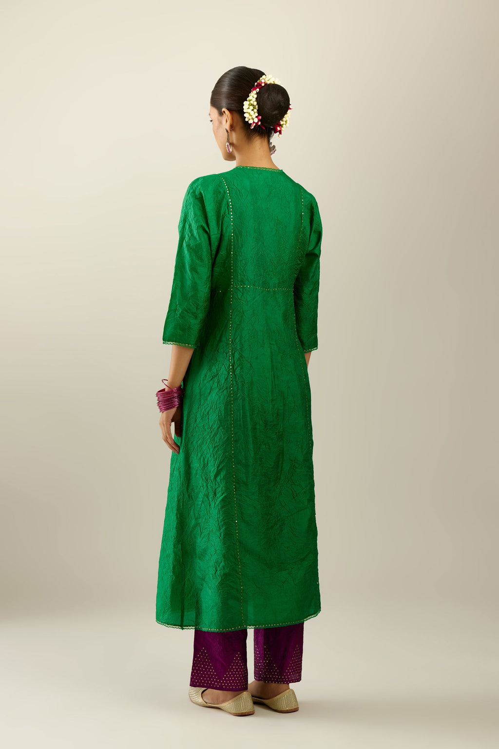 Silk hand crushed A-line kurta set, highlighted with gold sequins and embroidered scalloped edges.