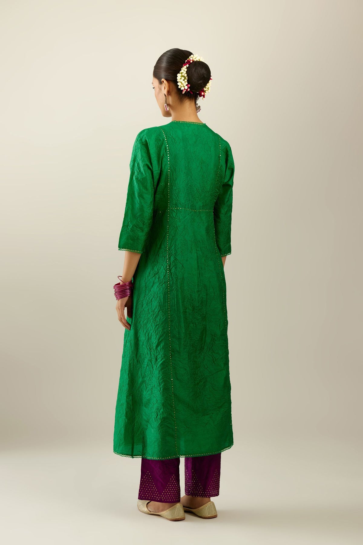 Silk hand crushed A-line kurta set, highlighted with gold sequins and embroidered scalloped edges.