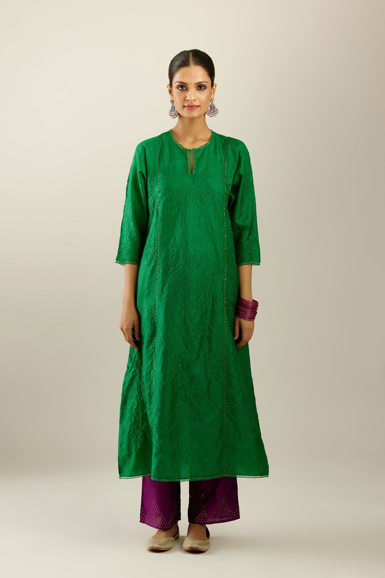 Silk hand crushed A-line kurta set, highlighted with gold sequins and embroidered scalloped edges.