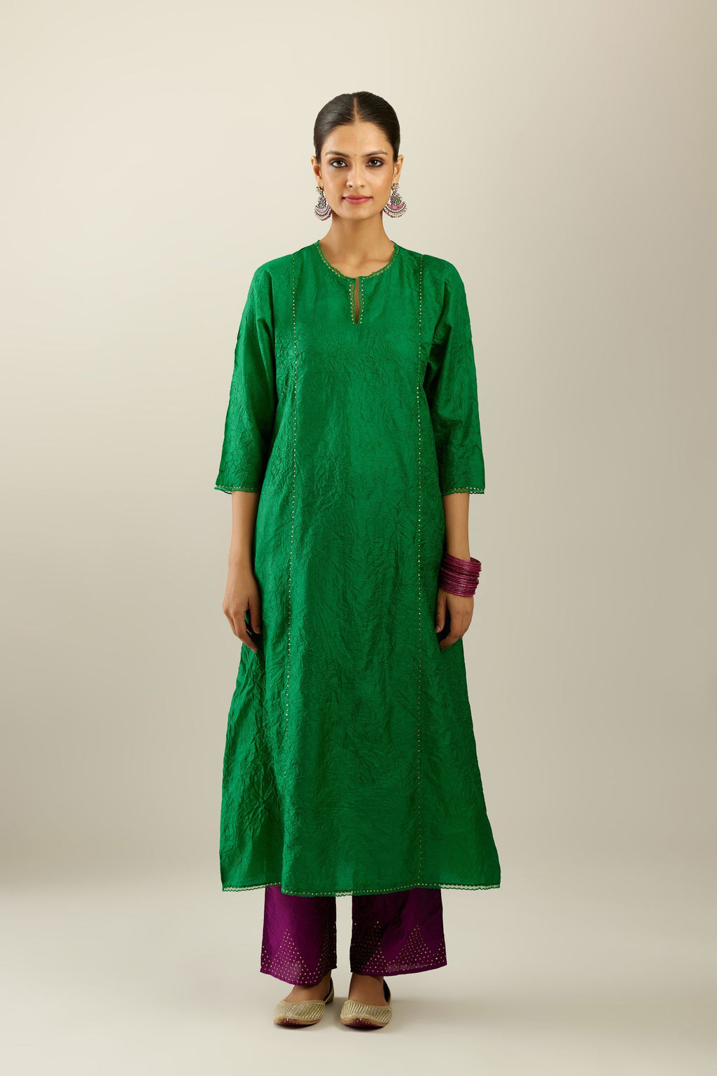 Silk hand crushed A-line kurta set, highlighted with gold sequins and embroidered scalloped edges.