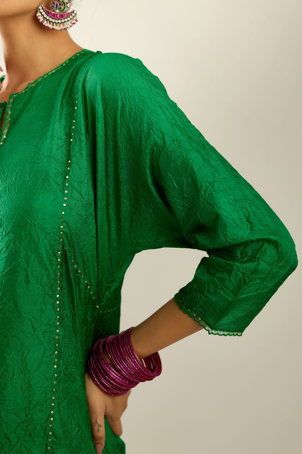 Silk hand crushed A-line kurta set, highlighted with gold sequins and embroidered scalloped edges.