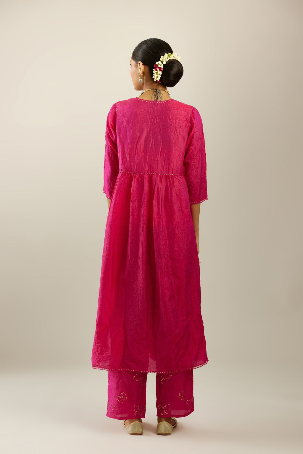 Raspberry silk hand crushed V neck gathered kurta set, highlighted with gold sequins and embroidered scalloped organza at edges.