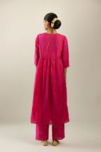 Raspberry silk hand crushed V neck gathered kurta set, highlighted with gold sequins and embroidered scalloped organza at edges.