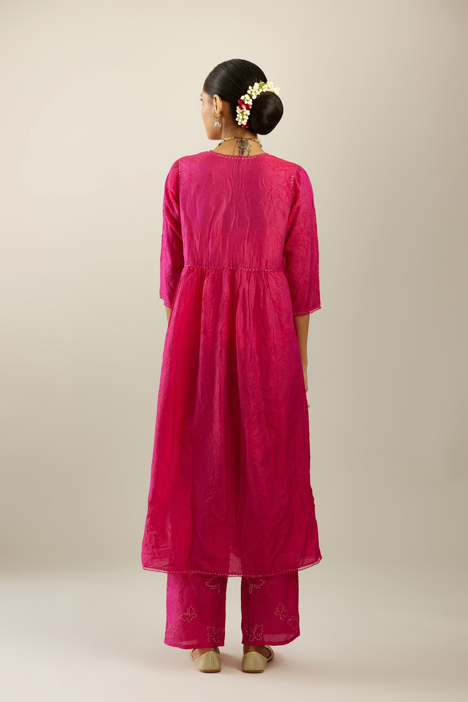 Raspberry silk hand crushed V neck gathered kurta set, highlighted with gold sequins and embroidered scalloped organza at edges.