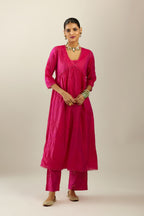 Raspberry silk hand crushed V neck gathered kurta set, highlighted with gold sequins and embroidered scalloped organza at edges.