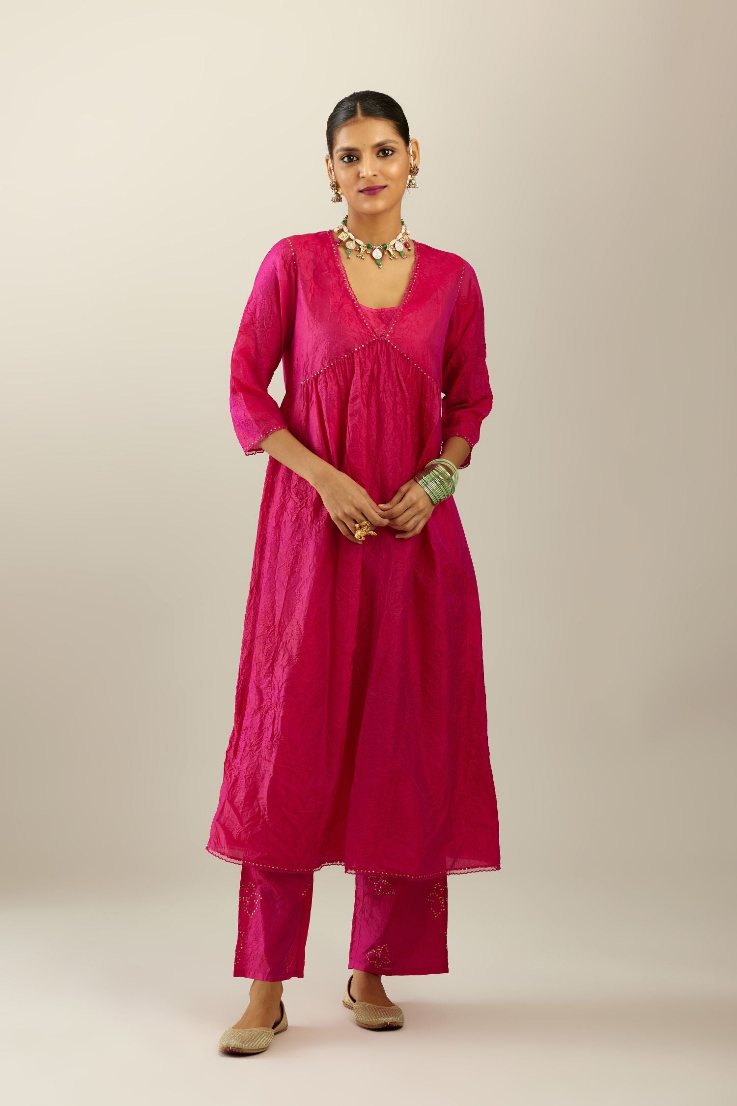 Raspberry silk hand crushed V neck gathered kurta set, highlighted with gold sequins and embroidered scalloped organza at edges.