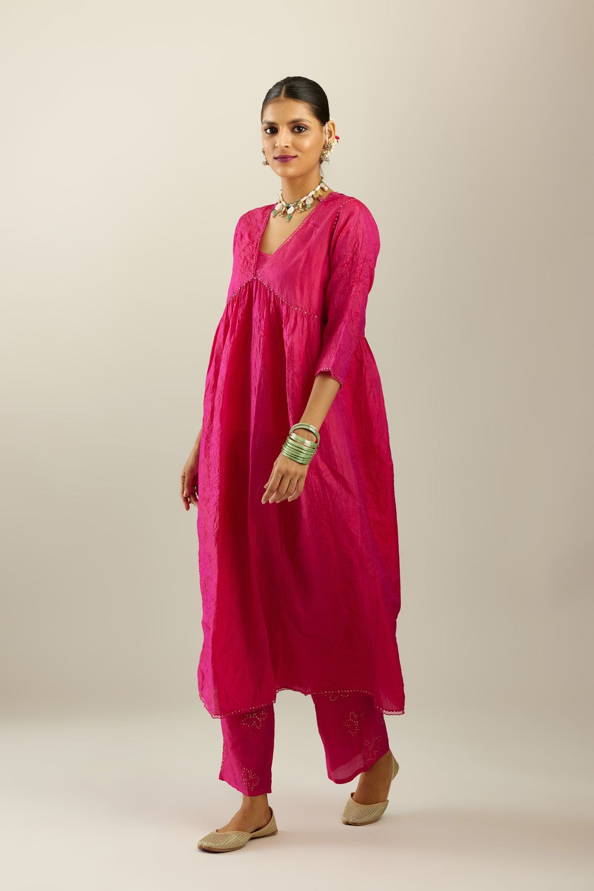 Raspberry silk hand crushed V neck gathered kurta set, highlighted with gold sequins and embroidered scalloped organza at edges.
