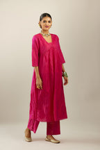 Raspberry silk hand crushed V neck gathered kurta set, highlighted with gold sequins and embroidered scalloped organza at edges.