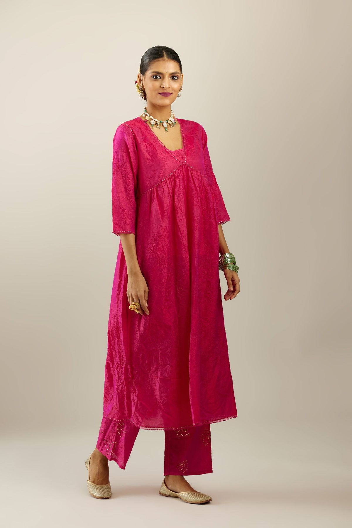 Raspberry silk hand crushed V neck gathered kurta set, highlighted with gold sequins and embroidered scalloped organza at edges.