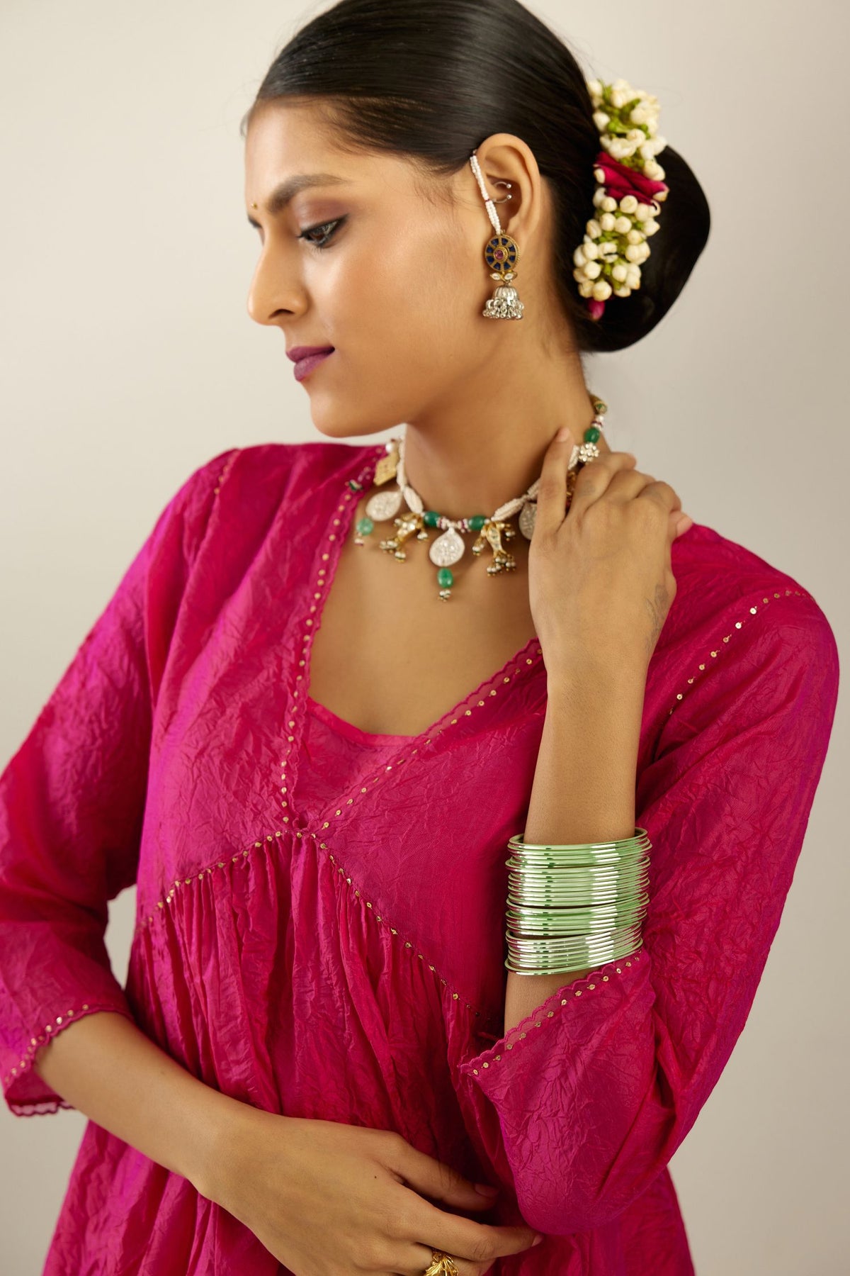 Raspberry silk hand crushed V neck gathered kurta set, highlighted with gold sequins and embroidered scalloped organza at edges.