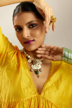 Deep yellow silk hand crushed V neck gathered kurta set, highlighted with gold sequins and embroidered scalloped organza at edges.