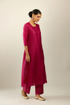 Silk hand crushed kurta set with concealed button placket neckline, highlighted with sequins and scalloped organza at edges.